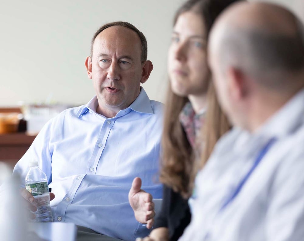 Expert leading discussion in office setting