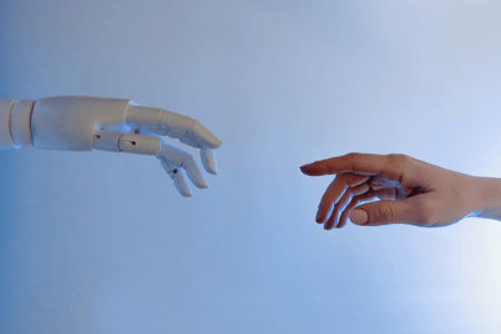 Robot hand reaches for human hand