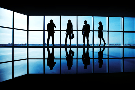 blue background with a team in shadows