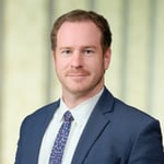 A headshot of Evan C. Jones